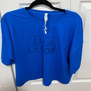 New without tags size 12,, Lululemon tee waist length. Moisture wicking